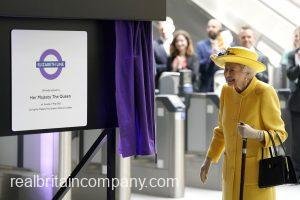 Queen beams in sunshine yellow for surprise visit to open Elizabeth Line in London